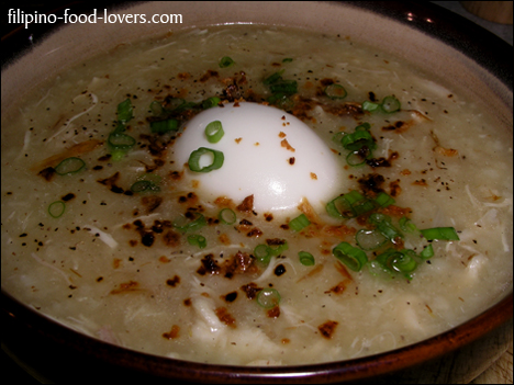 Arroz caldo in a bowl with egg